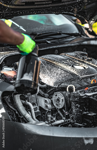 Car engine wash, car wash, hand wash, applying foam to the engine