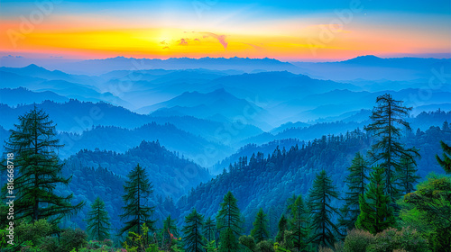 Vibrant sunrise over layered mountain ranges with silhouetted pine trees © João Macedo