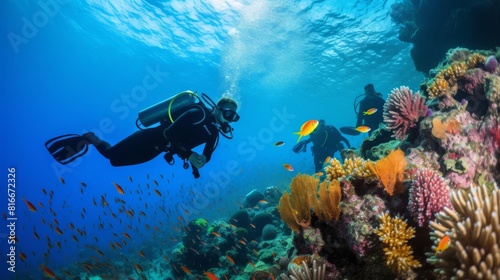 Underwater world. Scuba divers exploring a coral reef.