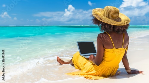 Woman working on laptop at beach resort during summer vacation with beautiful ocean view
