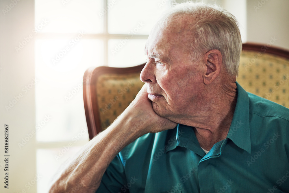 Obraz premium Elderly, man and depression with thinking of memory in retirement home with remember, nostalgia or reflection on sofa. Senior, person and sad with alzheimers, lonely and thoughtful on couch in lounge