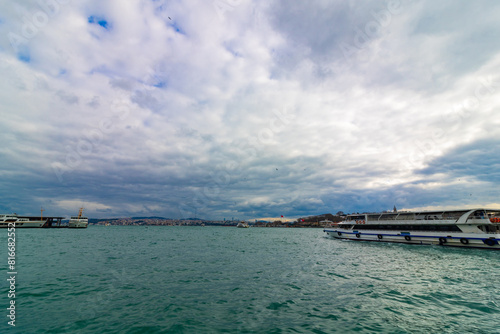 Istanbul view with cloudy sky and a boat. Visit Istanbul background
