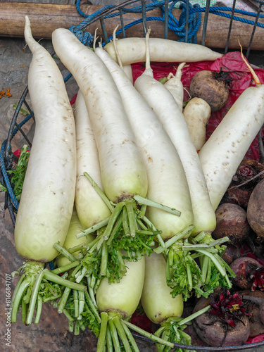 Organic daikon radish for sale at outdoor farmers market. Kathmandu