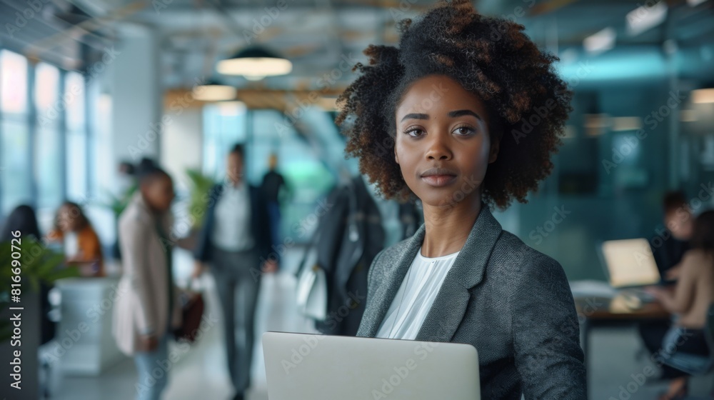 Confident Woman with Laptop at Office Confident Woman with Laptop at Office