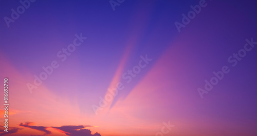 Canvas Print Colorful sunset sky background with pink and orange light beam on blue majestic