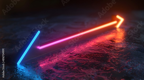 A neon-lighted arrow is on a dark surface. The colors of the arrow are red, blue, and green photo