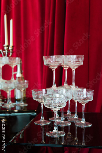 champagne glasses standing in a tower on the table, party