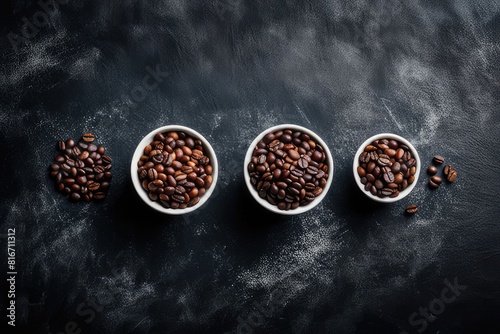 Top view of three different varieties of coffee beans on dark vintage background photo