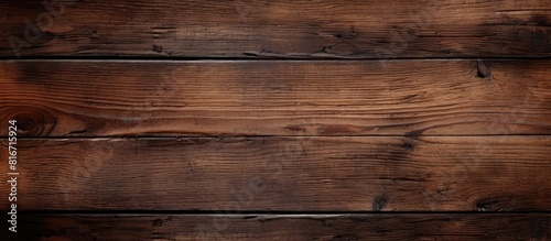 A background image with a textured dark brown wood pattern perfect for showcasing copies or placing text over. with copy space image. Place for adding text or design
