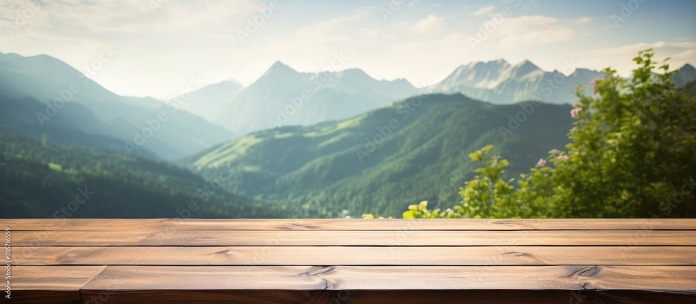 Scenic wooden table or desk with nature backdrop featuring a mountain view and a beautiful bokeh effect There s plenty of room for your text on the copy space image