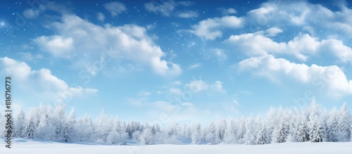 A scenic winter blue sky with white clouds and trees against which a copy space image can be placed 111 characters