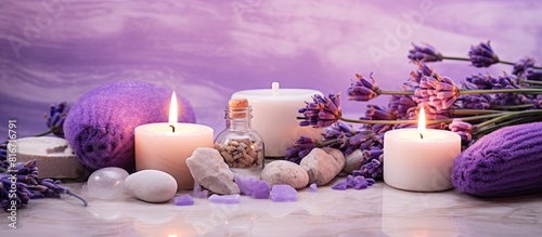A soothing lavender spa with sea salt aromatic candles body cream and handmade soap The natural herbal cosmetics showcase lavender flowers against a serene marble background creating a relaxing and b