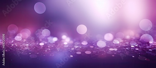 A purple bokeh light background with abstract elements perfect for adding a copy space image