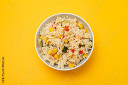 Cooked white rice mixed with colorful vegetables