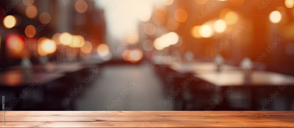 There is a copy space image of a table top with a blurred restaurant in the background There is a copy space image of a table top with a blurred restaurant in the background