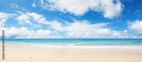 Tranquil serene landscape featuring a wide empty sand beach adorned by a beautiful cloudy sky offering a perfect atmosphere for relaxation Ample copy space image available for creative usage