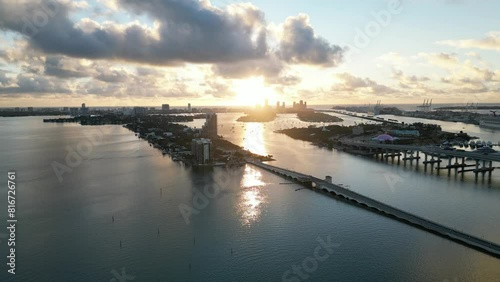 High drone footage of West Venetian Causeway Bridge crosses Biscayne Bay at sunset in Florida, USA photo