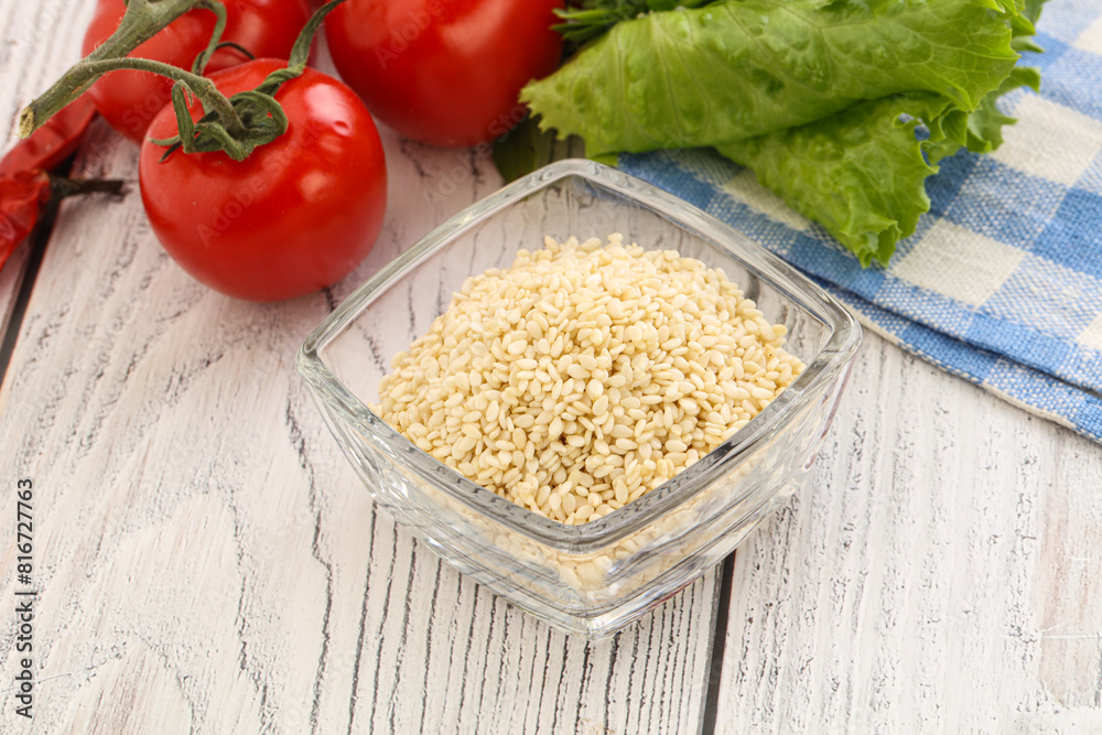 Raw sesame seeds in the bowl Raw sesame seeds in the bowl