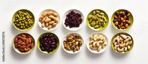 Top view copy space image of a delicious organic and healthy eating concept showcasing a snack menu with serving size portions of tasty pistachios