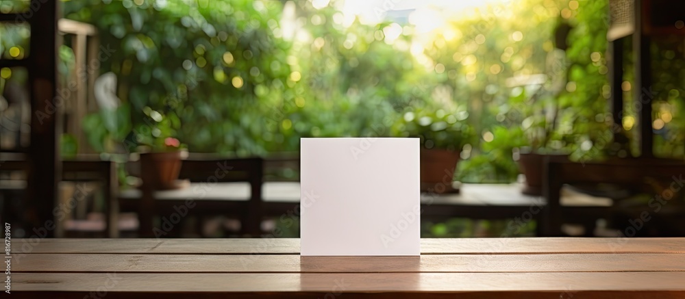 A wood table tent with a blank copy space image sits on a cafe table embodying the concept of reservations A wood table tent with a blank copy space image sits on a cafe table embodying the concept of reservations