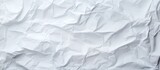 Top view of a clean white paper with a textured background resembling crumpled paper Ideal for use as a copy space image 134 characters