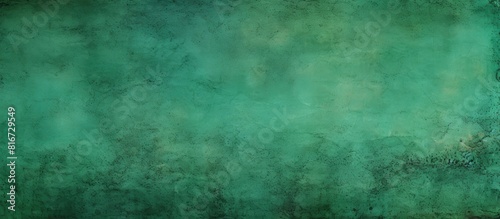 A worn green backdrop with grunge background or texture providing ample copy space for images