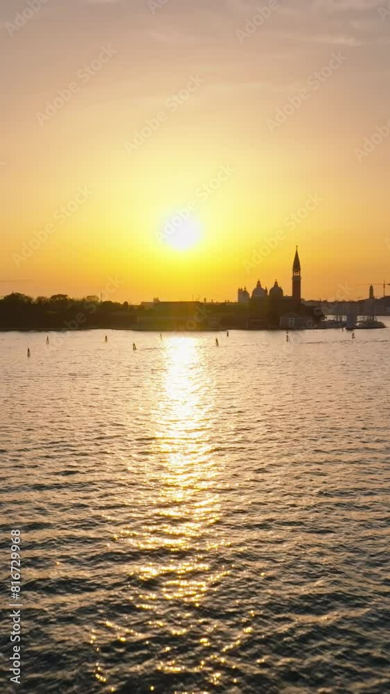 Aerial drone view of water surrounding Venice City, Italy, at sunset. Vertical Aerial drone view of water surrounding Venice City, Italy, at sunset. Vertical