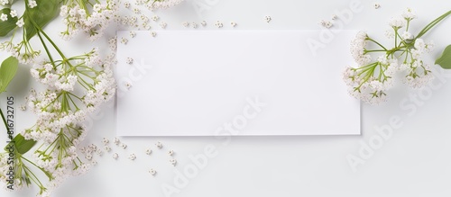 A white envelope with Gypsophila flowers on a white background creating a mockup suitable for greeting cards on occasions like Women s Day and Mother s Day. with copy space image