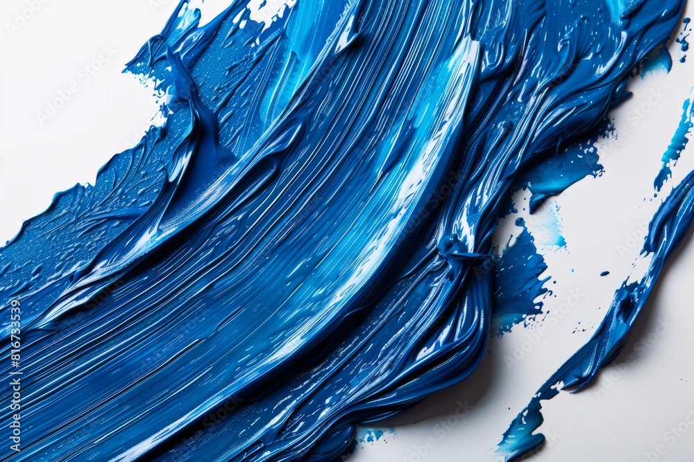 Detailed macro shot of vibrant electric blue paint brushstroke on a white background