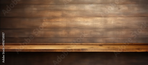 A copy space image of a wooden shelf attached to the wall can be seen as a backdrop