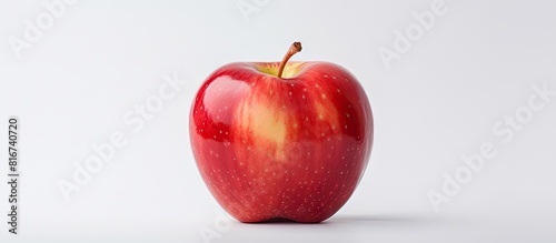 A single slice of a fresh apple with ample empty space around it captured against a white background in a copy space image