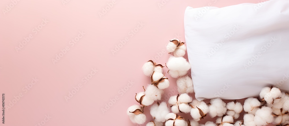 Top view of eco cotton pads with a sack on a colorful background creating a copy space image Top view of eco cotton pads with a sack on a colorful background creating a copy space image