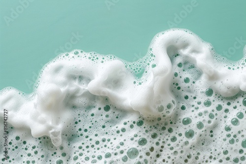 Detailed view of foamy waves crashing against a turquoise background