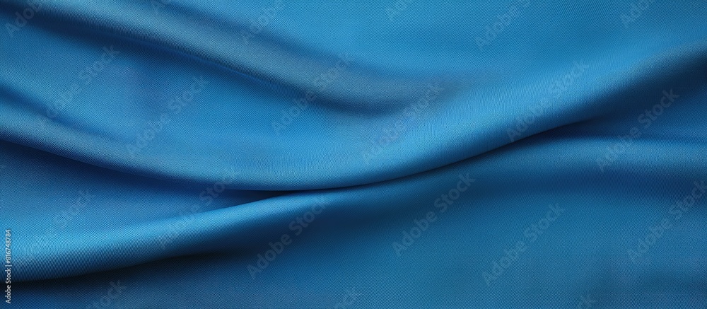 Fototapeta premium Top view of a blue fabric texture background with ample copy space for work and design purposes