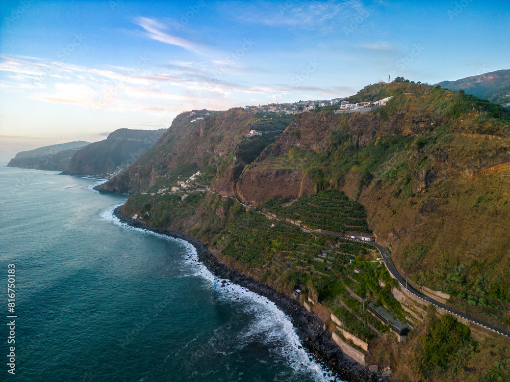 Aerial view of a stunning coastal landscape, featuring cliffs and tranquil waters. Madeira, Portugal Aerial view of a stunning coastal landscape, featuring cliffs and tranquil waters. Madeira, Portugal