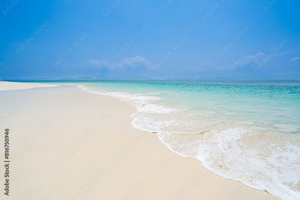 Beautiful sandy beach and sea water and waves in southern Thailand, Asia Beautiful sandy beach and sea water and waves in southern Thailand, Asia