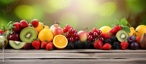 Copy space image of fresh and healthy fruits placed on a wooden background