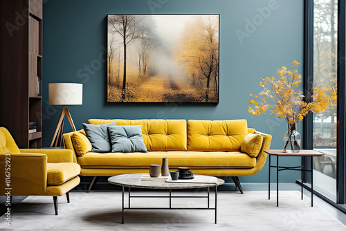 Vibrant yellow sofa and chair near teal wall with poster frame. Scandinavian interior design of modern living room.