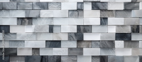 Abstract background of white grey and black ceramic mosaic wall tiles provides a textured and visually appealing option for bathroom decor This top view composition offers ample copy space for additi photo