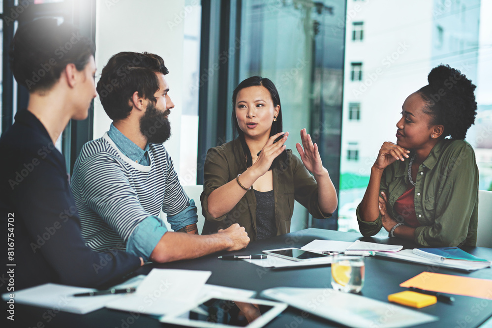© peopleimages.com - Business meeting, people and teamwork with paperwork for employee training and communication in office. Corporate group, brainstorming and documents for intern feedback, advice and support at seminar