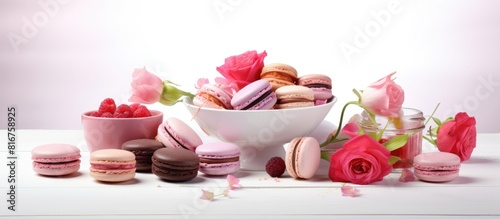 Heap of pink macaroons French cookies on white table. copy space available