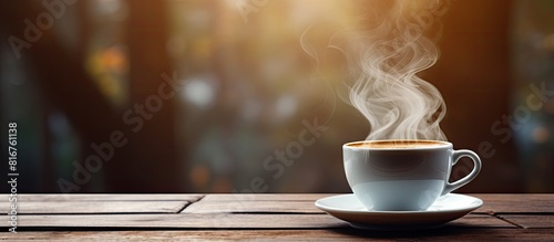 Closeup image of hot coffee cup on vintage wooden table in cafe. copy space available
