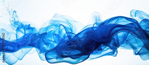 Closeup of a blue ink in water in motion isolated on white Ink swirling underwater Colored abstract smoke explosion effect Abstract background with copy space