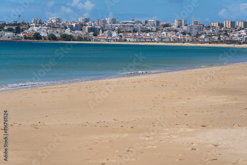 Meia Praia beach in Lagos, Algarve, Portugal. Crystal clear sea water. Sunny day.