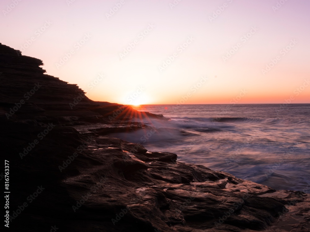 Scenic view of rocky coastline of Kalbarri, Western Australia in long exposure at sunset Scenic view of rocky coastline of Kalbarri, Western Australia in long exposure at sunset