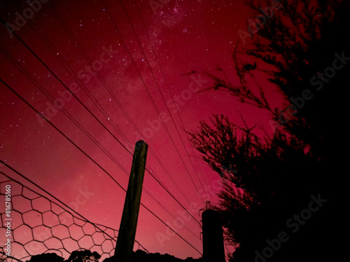 Milky Way through pink Aurora Australis 