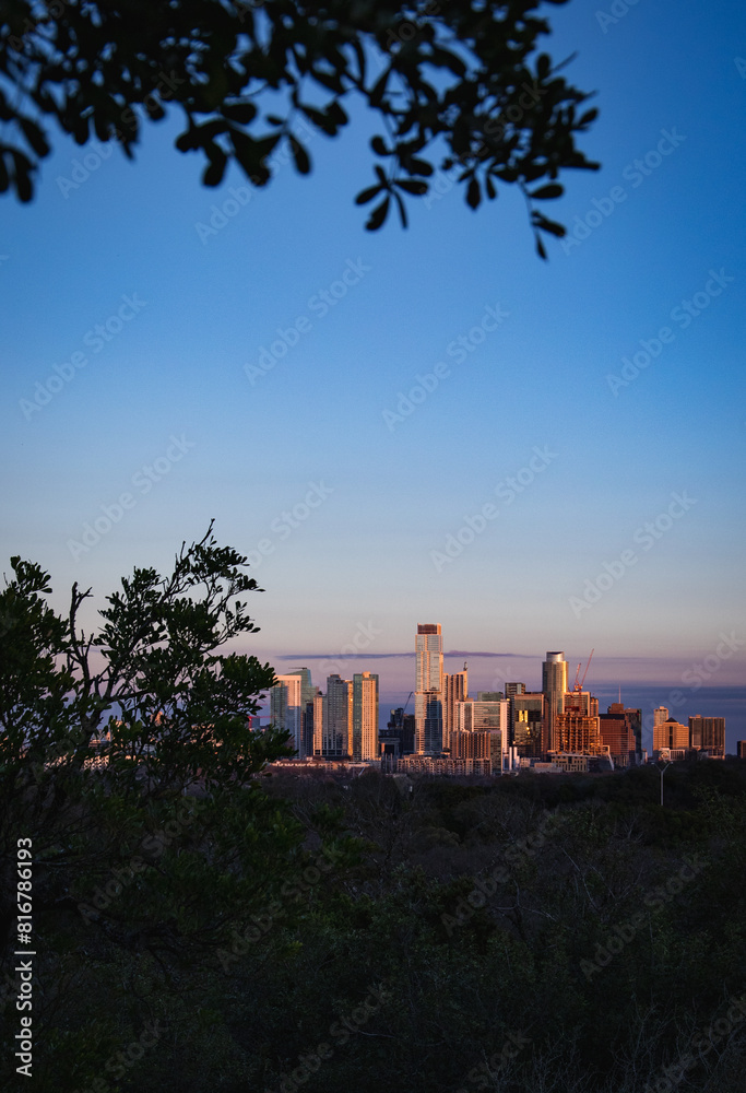Fototapeta premium Aerial view of the beautiful skyline of Downtown Austin, Texas illuminated by the golden sunset