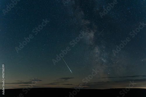 Perseid Meteor across the night sky alongside the Milky Way core from Northumberland photo