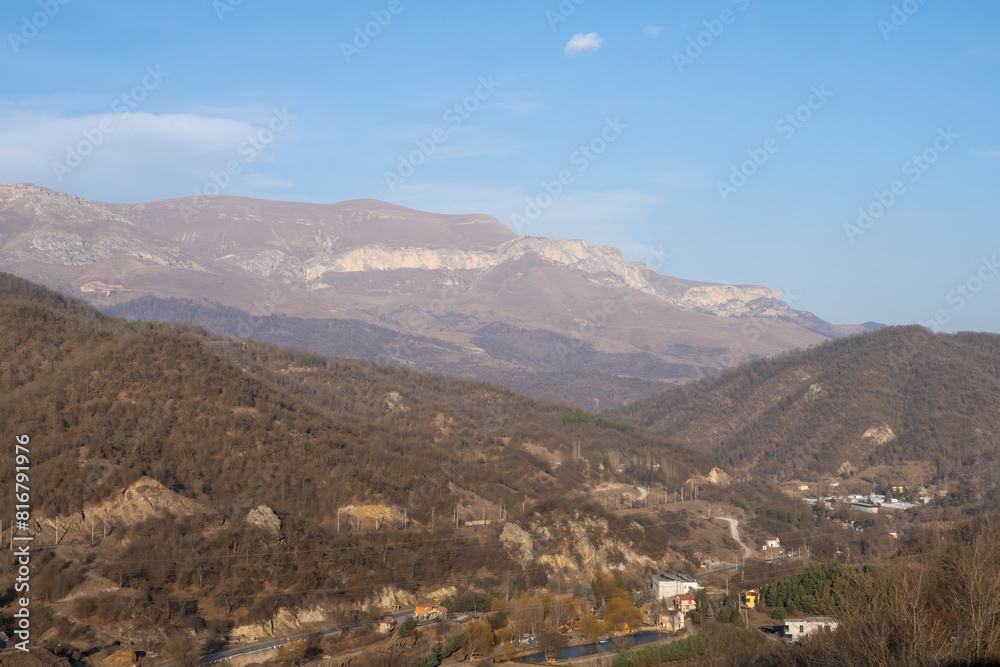 Fototapeta premium Mountain landscape Armenia. Forest nature dilijan. Tavush region. Nature Armenia as seen from quadcopter. Mountain forest in dilijan. Houses and road in mountainous area. Landscape from bird eye view