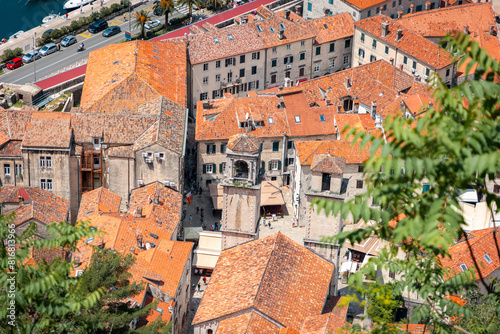 Top view of panorama of old town of Kotor and the Church of St. Tryphon. Balkan houses with red roofs
